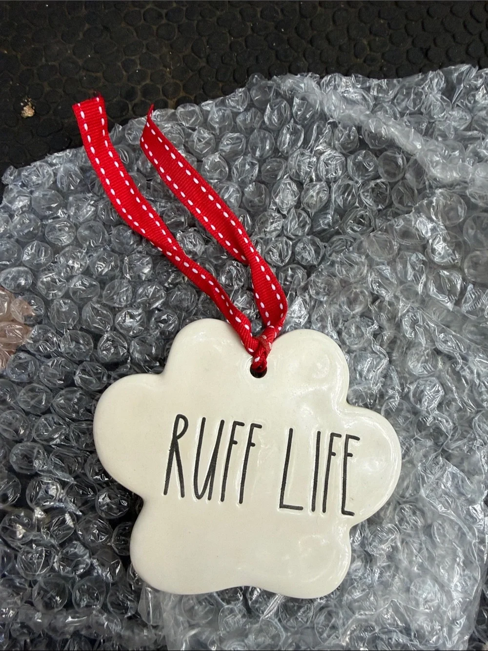 Rae Dunn Cream 'Ruff Life' Dog Paw Ornament with Red Ribbon